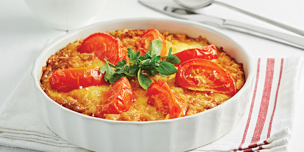 Clafoutis van tomaten, ricotta en spekjes, met gestoomde broccoli